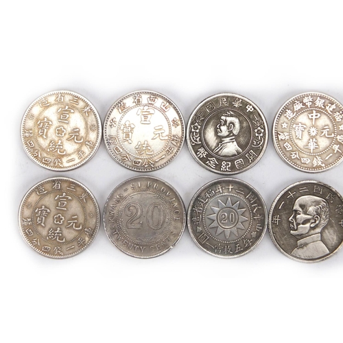 2576 - Twelve Chinese silver coloured metal coins including Queen Victoria design example