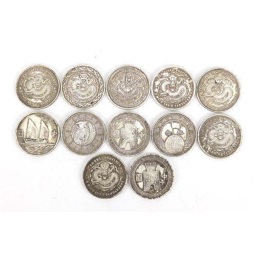 2574 - Twelve Chinese silver coloured metal coins