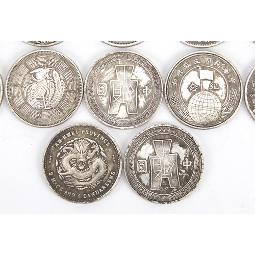 2574 - Twelve Chinese silver coloured metal coins