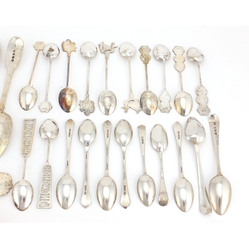 2550 - Georgian and later silver flatware including souvenir teaspoons, serving spoons and napkin ring, var... 