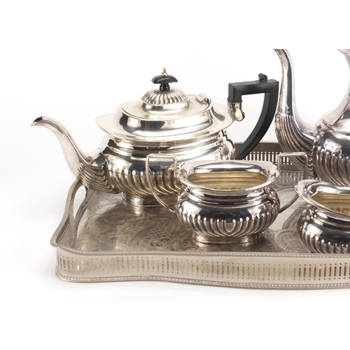 474 - Silver plated four piece tea service and a gallery tray