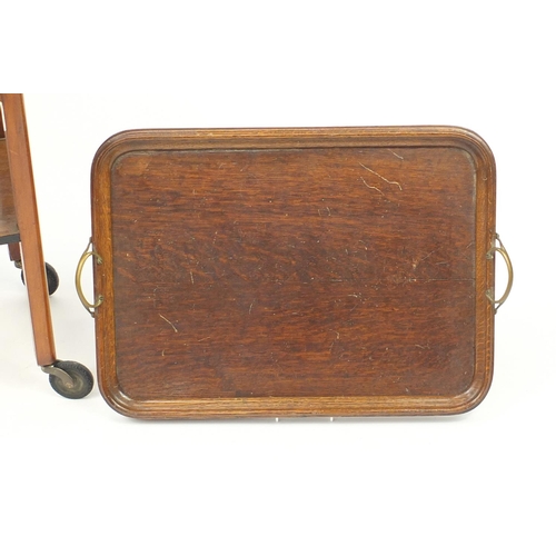 183 - Walnut two tier trolley and an oak tray with brass handles