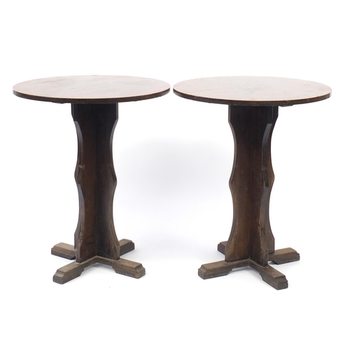 104 - Pair of circular oak pub tables, 74cm high x 61cm in diameter