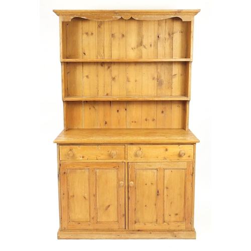 23 - Pine dresser with open plate rack above two drawers and a pair of cupboard doors, 198cm H x 122cm W ... 