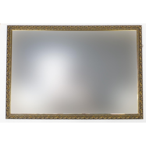 130 - Rectangular gilt framed wall hanging mirror with bevelled glass, 100cm x68cm