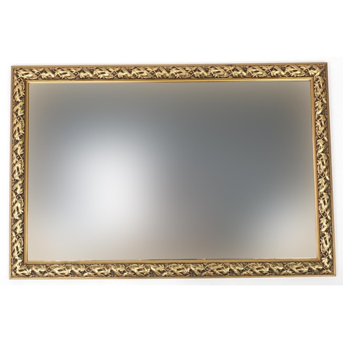 71 - Large rectangular wall hanging mirror with gilt fruit and leaves frame, 119cm x 79cm