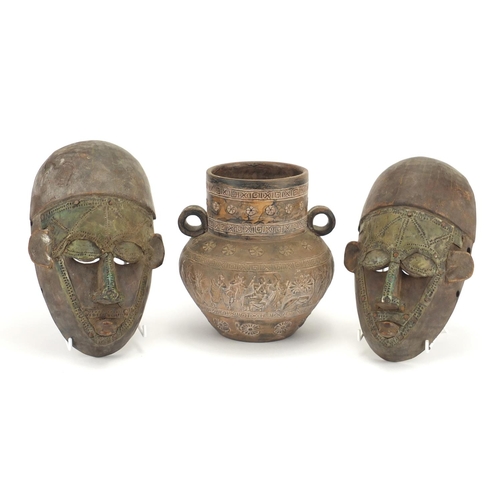 800 - Pair of African face masks and a terracotta vessel