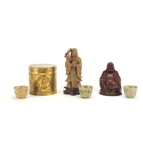 804 - Chinese objects including three carved stone tea bowls, a soapstone figure and brass cylindrical pot... 