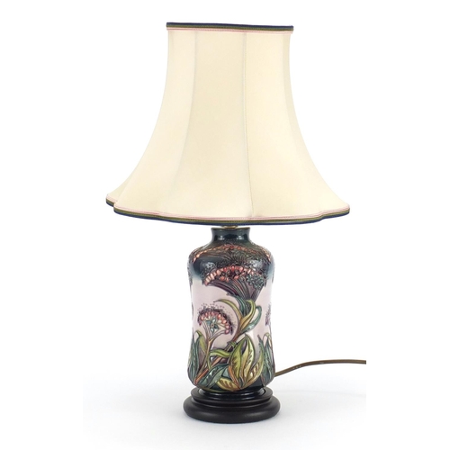 2322 - Moorcroft pottery lamp base with silk lined shade, hand painted and tube lined with stylised flowers... 