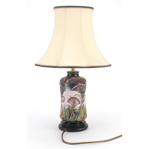 2322 - Moorcroft pottery lamp base with silk lined shade, hand painted and tube lined with stylised flowers... 