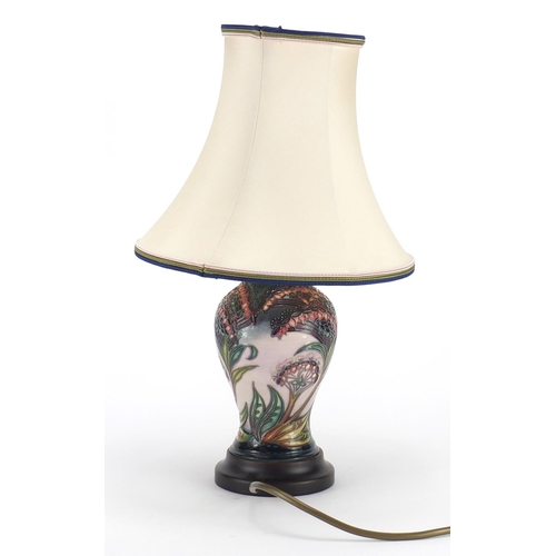 2276 - Moorcroft baluster vase lamp base with silk lined shade, hand painted and tube lined with stylised f... 