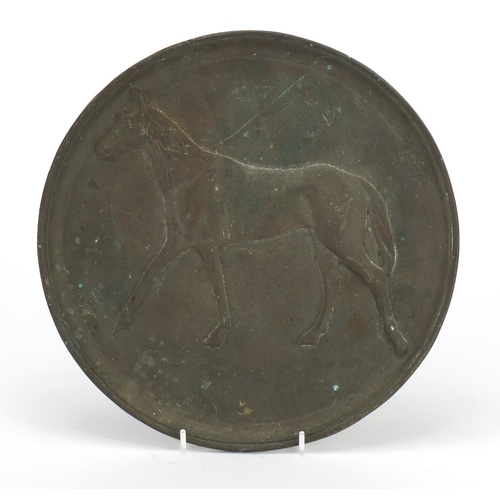 2523 - Bronze plaque cast with a horse, 26.5cm in diameter