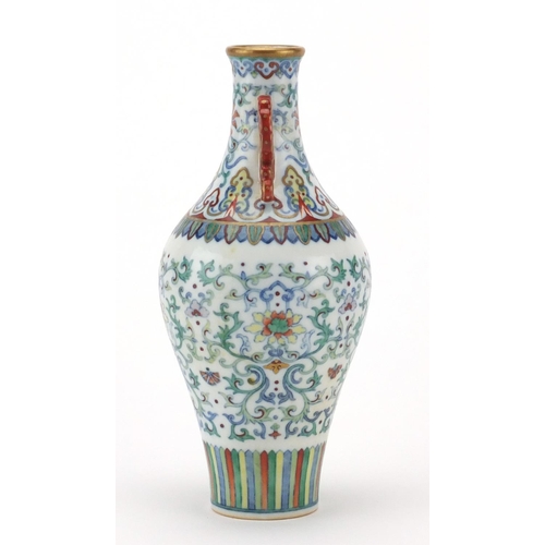 193 - Chinese porcelain doucai vase with iron red handles, finely hand painted with flower heads amongst f... 