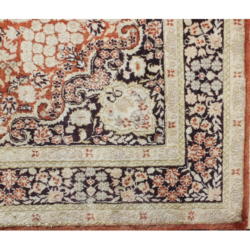 2013 - Fine Rectangular silk rug having all over stylised motifs within corresponding borders, onto a midni... 