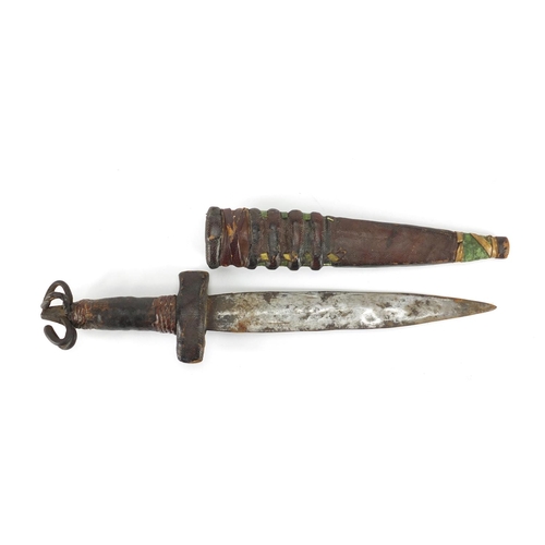 975 - Middle Eastern leather bound dagger with scabbard, 28cm in length