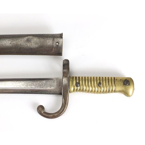 972 - Military interest bayonet and scabbard, impressed marks to the blade, 71cm in length