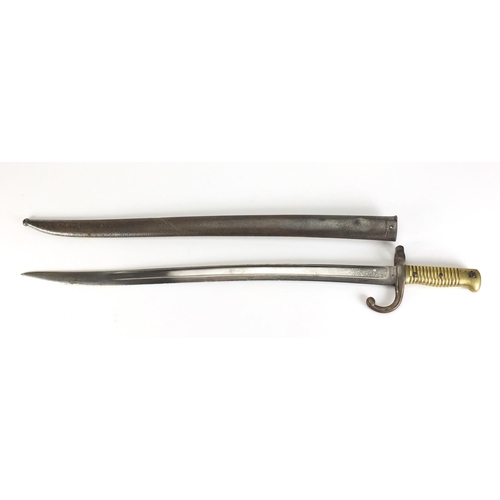 972 - Military interest bayonet and scabbard, impressed marks to the blade, 71cm in length