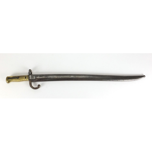 972 - Military interest bayonet and scabbard, impressed marks to the blade, 71cm in length