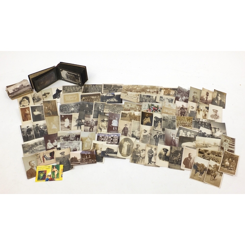 108 - Collection of postcards, some black and white photographic including military examples