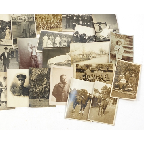 108 - Collection of postcards, some black and white photographic including military examples