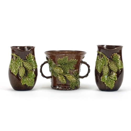 421 - Rye Hop Ware including a pair of vases and twin handled cup, the largest 10cm high