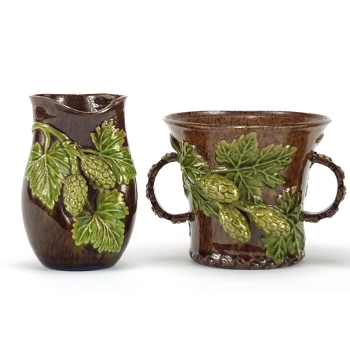 421 - Rye Hop Ware including a pair of vases and twin handled cup, the largest 10cm high