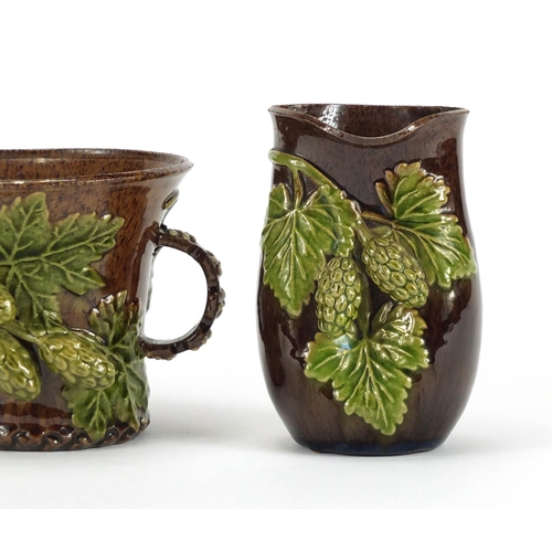 421 - Rye Hop Ware including a pair of vases and twin handled cup, the largest 10cm high