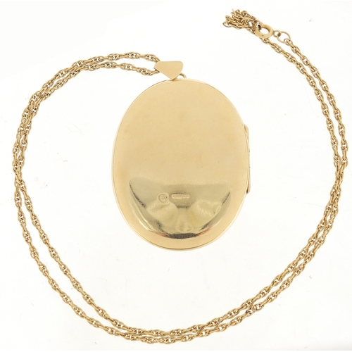 594 - Large 9ct gold locket on a 9ct gold rope twist necklace, the locket 6.5cm in length, approximate wei... 