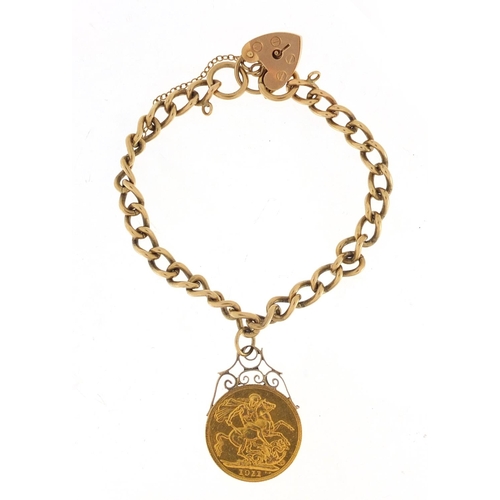 2635 - George V 1911 gold sovereign mounted on a 9ct gold bracelet, approximate weight 23.7g