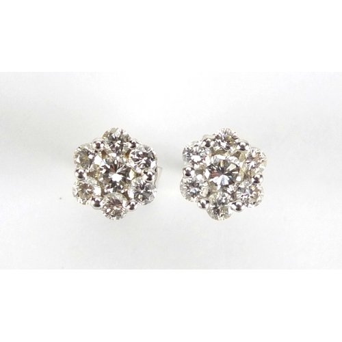 592 - Pair of 18ct white gold diamond flower head earrings, 7mm in diameter, approximate weight 1.6g