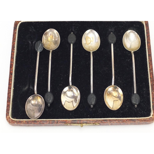 2542 - Silver items including a trumpet bud vase, napkin rings, set of six coffee bean spoons and two silve... 