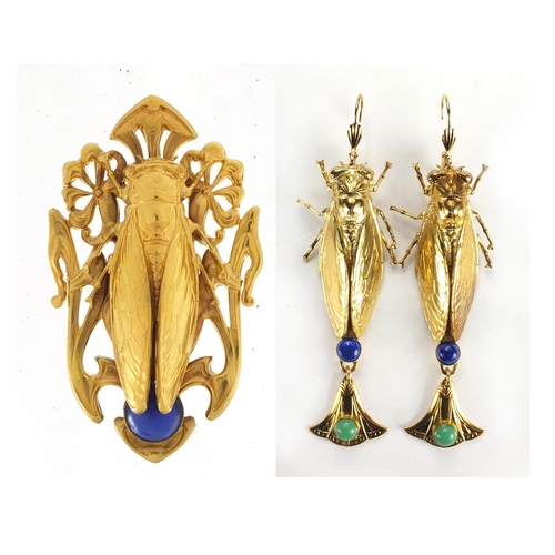 509 - Pair of Egyptian Revival gilt metal locust design earrings with drops and a pendant, 9cm high