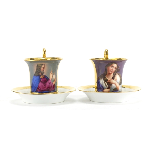 402 - Good Pair of 19th century continental porcelain cabinet cups and saucers, hand painted with Madonna ... 