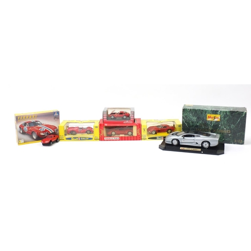 482A - Five boxed die cast vehicles and model kit including Revell Ferrari's and a Maisto Jaguar XJ220