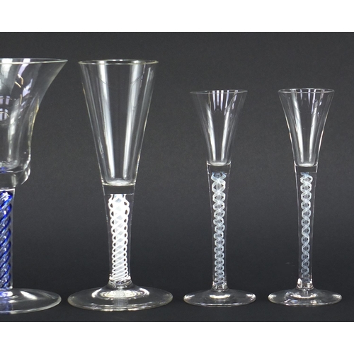 2346 - Four George III style glasses including three with air twist stems, the largest 17.5cm high
