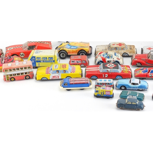2440 - Vintage and later tin plate vehicles including Japanese and German examples, the largest approximate... 