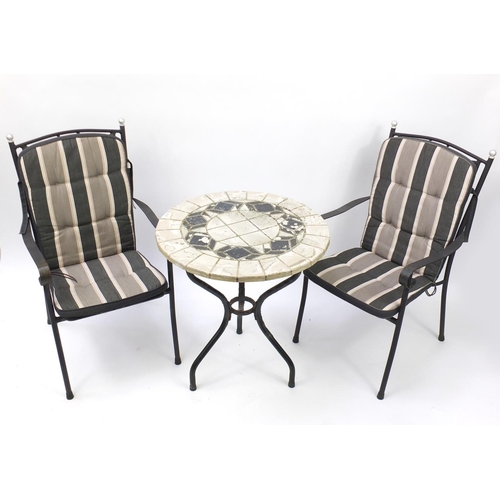 38 - Circular marble top garden table with two chairs, the table 73cm high x 68cm in diameter