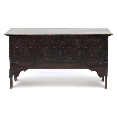 2031 - Oak plank chest with Arcadian and Fleur de Lis carved panel front, 65cm H x 121cm W x 43cm D