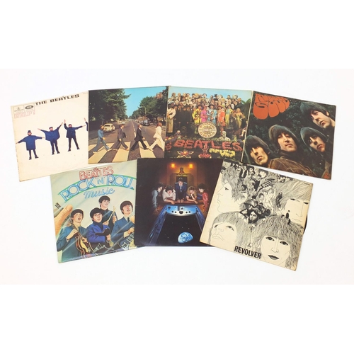 2611 - Seven Beatles vinyl LP's including Sgt. Pepper's Lonely Hearts Club Band with cut out, Abbey Roads, ... 