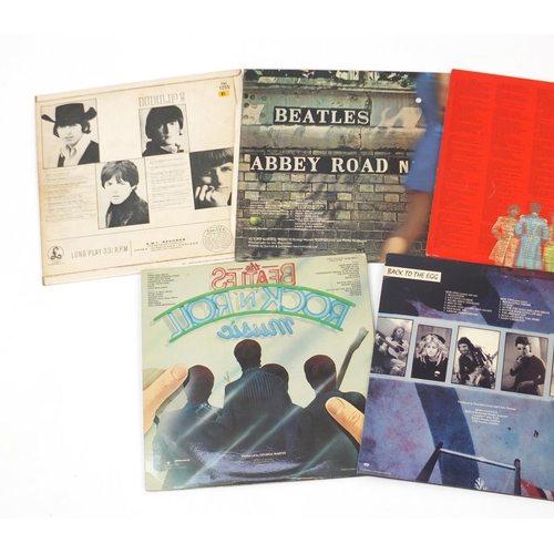 2611 - Seven Beatles vinyl LP's including Sgt. Pepper's Lonely Hearts Club Band with cut out, Abbey Roads, ... 