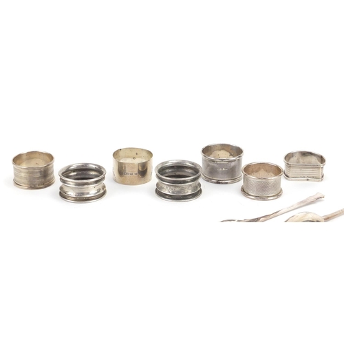 2547 - Seven silver napkin rings and five spoons, various hallmarks, approximate weight 230.0g