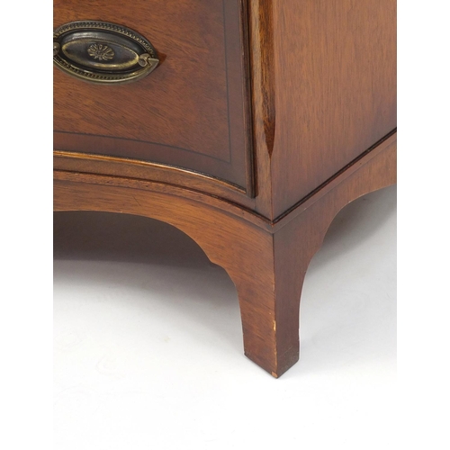 2005 - Good quality reproduction mahogany serpentine chest with yew wood banding and brushing slide above f... 