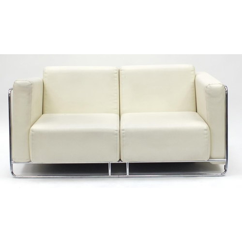 2086 - Contemporary cream faux leather and chrome framed two seater settee, 150cm wide