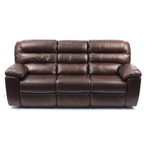 2010 - Brown leather electric reclining three seater 
settee, 212cm wide