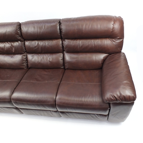2010 - Brown leather electric reclining three seater 
settee, 212cm wide