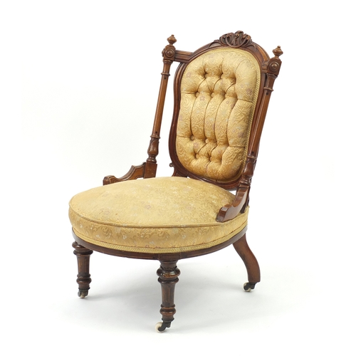 2068 - Victorian walnut nursing chair with gold button back floral upholstery, 78cm high