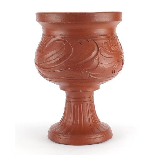 2142 - Roman style terracotta pedestal vessel decorated with flowers, 34cm high