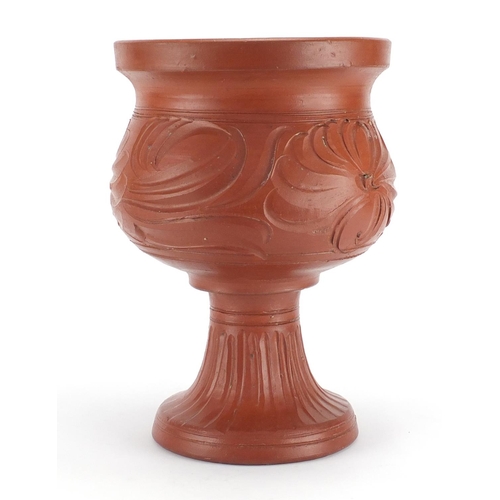 2142 - Roman style terracotta pedestal vessel decorated with flowers, 34cm high