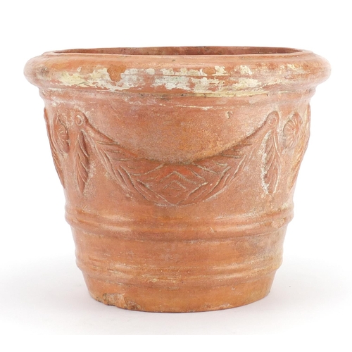 2143 - Roman style terracotta vessel decorated in relief with swags, 24cm high
