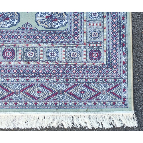 2112 - Rectangular Bokhara design green ground floral rug, 230cm x 160cm